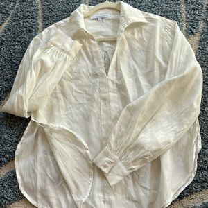 Used women’s endless rows blouse with front detailing and high side slit
